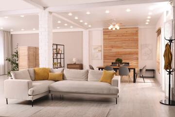 Wall Mural - Stylish living room interior with comfortable sofa and wooden table