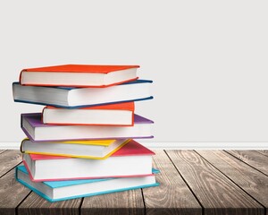 Poster - Stack of colorful books collection on the desk