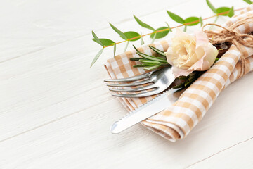 Beautiful table setting on white wooden background