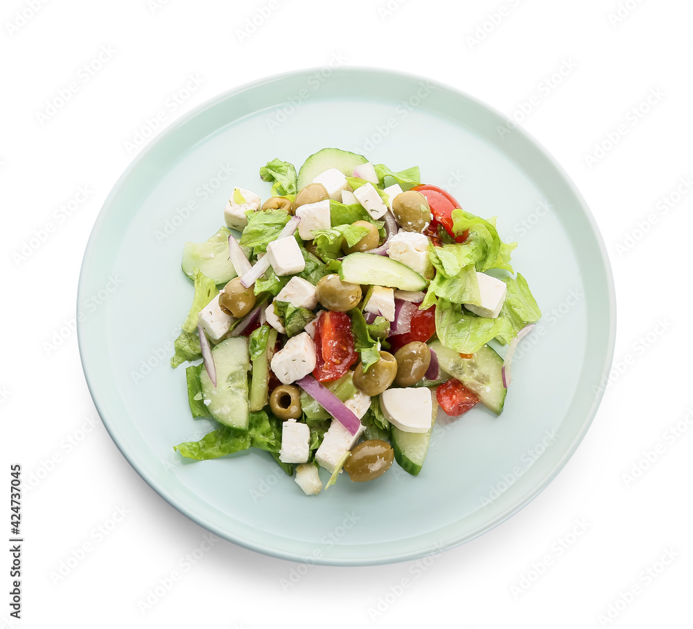 Plate with fresh Greek salad on white background