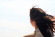 © allensima - closeup rear view of Asian beauty enjoying life outdoor wind blown hair