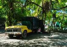Old Yellow Truck On A Beach In Costa Rica