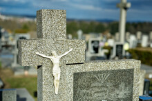 Cemetery With Tombstones In The Shape Of A Cross, Angels. Many Decorated Graves