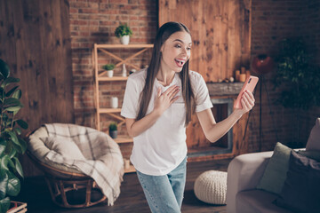 Poster - Photo of young attractive woman happy positive smile speak talk video call cellphone virtual laugh indoors