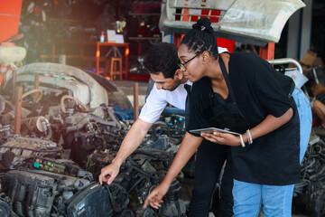 Wall Mural - Happy Harmony people at workplace, smiling white man and African American worker working together a, two people checking product stock at auto spare parts store shop warehouse 
