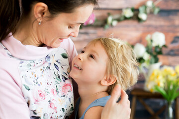 Sticker - Mother, hugging sweet toddler child, blond boy at home