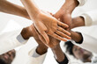 © Andrey Popov - African American Medical Team Hands Stack