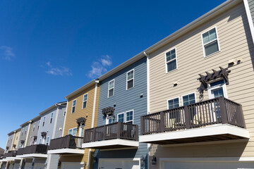 Wall Mural - A row of attached residential suburban townhomes