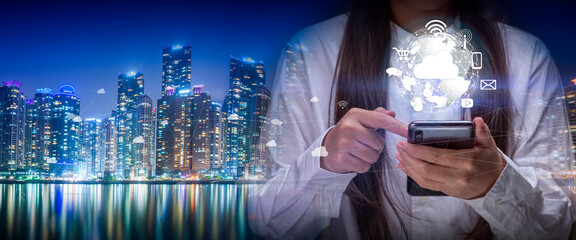 Hand holding a digital world with Smart services icons and internet of things, wireless networks, Information communication technology concept.