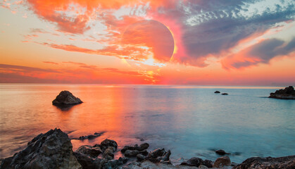 Wall Mural - Long exposure photo - Beauty sunset over the sea - Beautiful landscape with solar eclipse