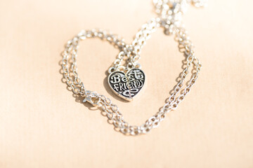 Canvas Print - Set of best friends heart made up of two parts necklace shoot outside in a summer day closeup. Selective Focus. High quality photo