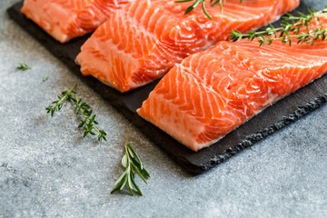 Wall Mural - Salmon. Fresh raw salmon fish fillet with cooking ingredients, herbs and lemon. Close up. healthy food, diet or cooking concept