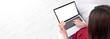 © weedezign - Asian female use credit card shopping online with laptop sitting on sofa,Mock up banner background display of your design,Clipping path on screen