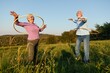 © Lumos sp - woman man outdoor senior couple happy retirement together smiling love spinning hoop exercise mature