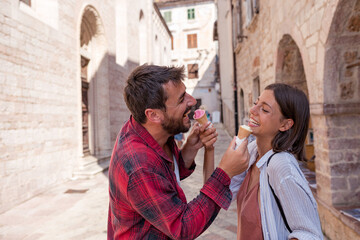 Wall Mural - Sweet love couple eating ice cream on vacation