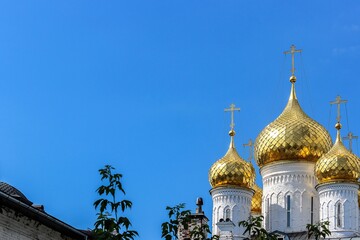 Russia, Kostroma, July 2020. Three towers with golden domes.