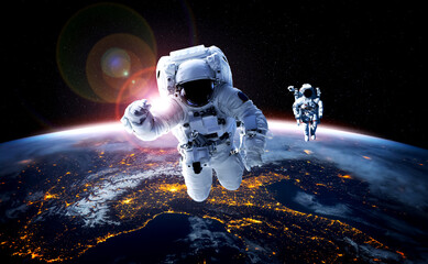 astronaut spaceman do spacewalk while working for space station in outer space . astronaut wear full