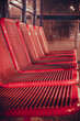 Red seats at the train station.