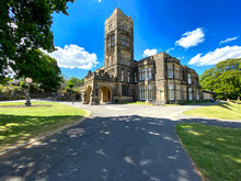 Cliffe Castle Museum, In The Local Public Park, With Lawns, Old Trees, And A Blue Sky In, Keighley, Yorkshire, UK