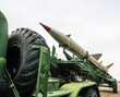 Russian multiple rocket launcher mounted on soviet military truck on sunny blue sky background. Russian military ballistic missiles.