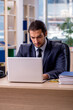 © Elnur - Young businessman employee working in the office
