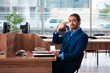 © Elnur - Young male employee working in the office