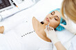 © rogerphoto - Professional cosmetologist making injection in face, lips. Young woman gets syringe with filler for face contouring or augmentation. Face aging, rejuvenation and hydration procedures