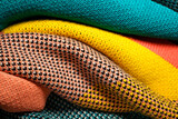 Fototapeta  - Smooth folded multi colored knitted fabrics