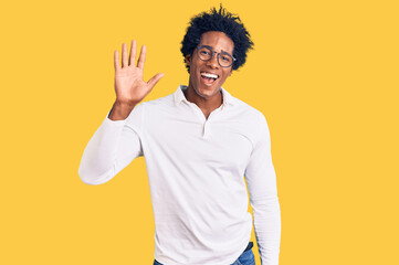 Poster - Handsome african american man with afro hair wearing casual clothes and glasses waiving saying hello happy and smiling, friendly welcome gesture