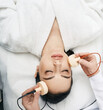 © Peakstock - Beautiful woman receives microcurrent procedure for a facelift. Skin rejuvenation and face lift with microcurrent therapy