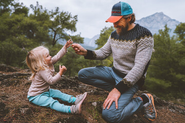 Wall Mural - father and daughter child playing outdoor in forest travel family lifestyle summer vacations happy e