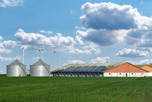 Modern Dairy Farm Using Renewable Energy, Solar Panels And Wind Turbines