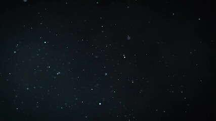 Wall Mural - Small blue like particles floating for background footage. 