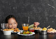 © lichaoshu - Cute Asian little girl eating happily