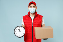 Delivery Guy Employee Man In Red Cap White T-shirt Vest Uniform Sterile Face Mask Gloves Work Courier Service On Lockdown Covid19 Flu Virus Hold Empty Cardboard Box Isolated On Pastel Blue Background