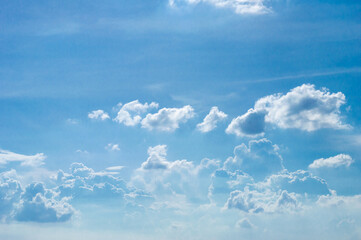 Wall Mural - abstract white fluffy clouds and blue sky in sunny day background.natural celestial world concept wi