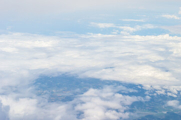 Wall Mural - over the clouds,blue sky with tiny clouds background beautiful natural view from airplane window abo