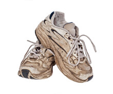 Old, Worn Sneakers On White Background