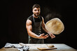 © Nataliya Schmidt - Handsome sexy chef preparing pizza dough
