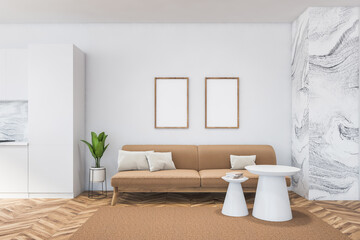 Bright modern living room interior with two empty blank posters