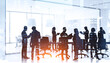 © ImageFlow - Business people in conference room, skyscrapers at night