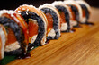 Seafood delicatessen salmon sushi black maki rolls