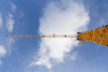 Poster - Tower construction crane against the blue sky. Big Yellow Construction Crane