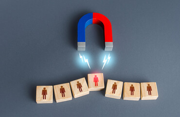 the magnet selects one person from the row. finding the best recruiting candidate. human resources. 