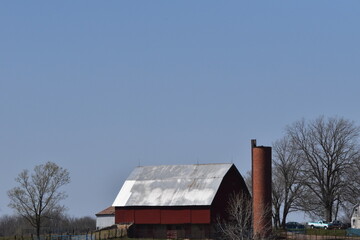 Canvas Print - Old Red Barn and a Brick Silo