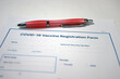 © jdoms - Covid-19 vaccine registration form and pen