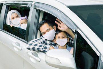 Wall Mural - Muslim family in mask driving for travel on vacation