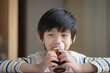 © lalalululala - Little asian boy drinking soft drink coca cola soda