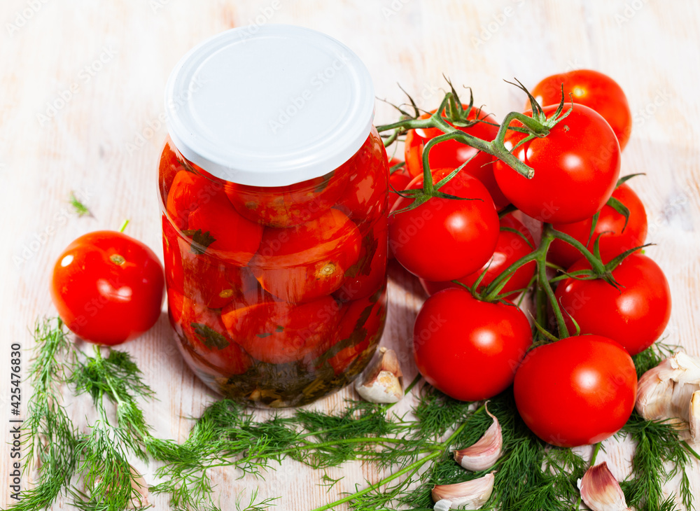 Fresh tomatoes canned in glass jar, homemade pickles - obrazy, fototapety, plakaty 
