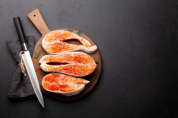 Sticker - Fresh raw salmon cooking. Fish steaks with herbs and spices